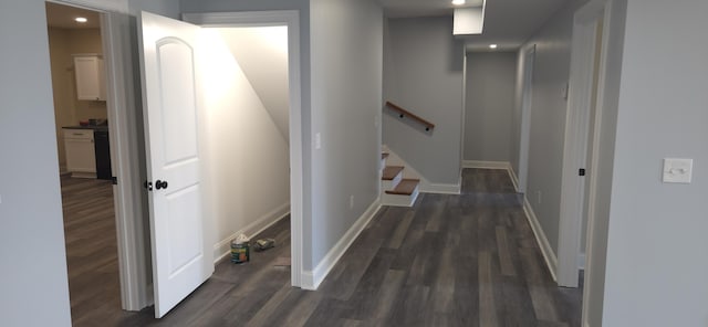 hallway with stairway, baseboards, and wood finished floors