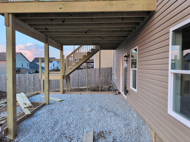 patio terrace at dusk with stairs and fence