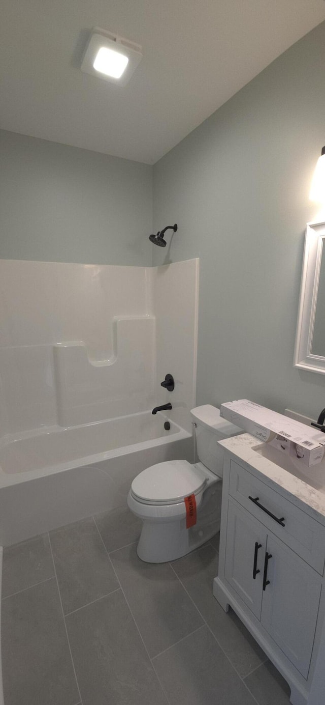 bathroom with toilet, vanity, and bathtub / shower combination