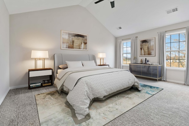 carpeted bedroom with visible vents, vaulted ceiling, baseboards, and ceiling fan