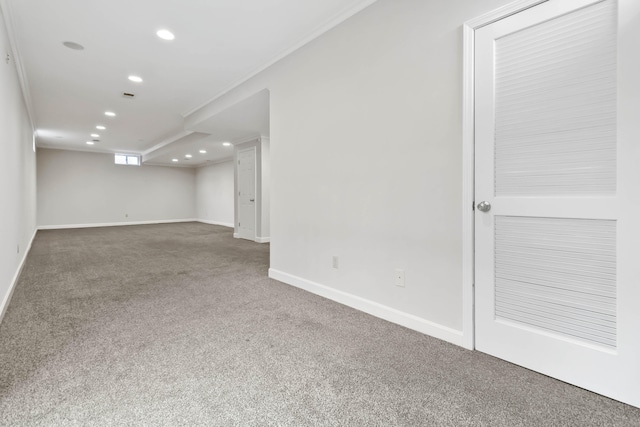 basement featuring carpet floors, baseboards, and recessed lighting