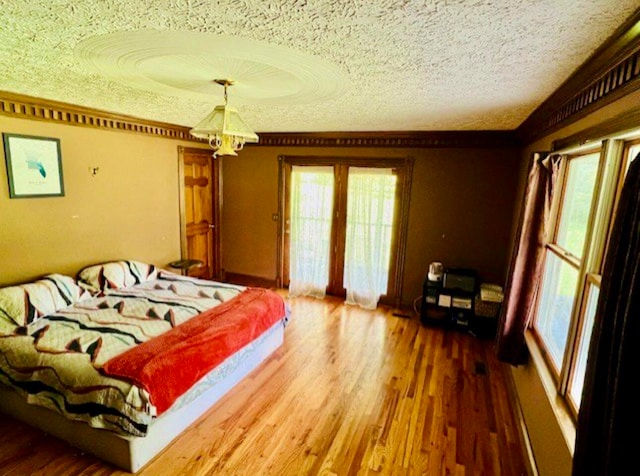 bedroom featuring dark wood-type flooring and a textured ceiling