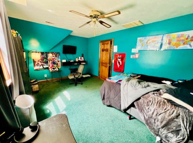 bedroom featuring ceiling fan and carpet