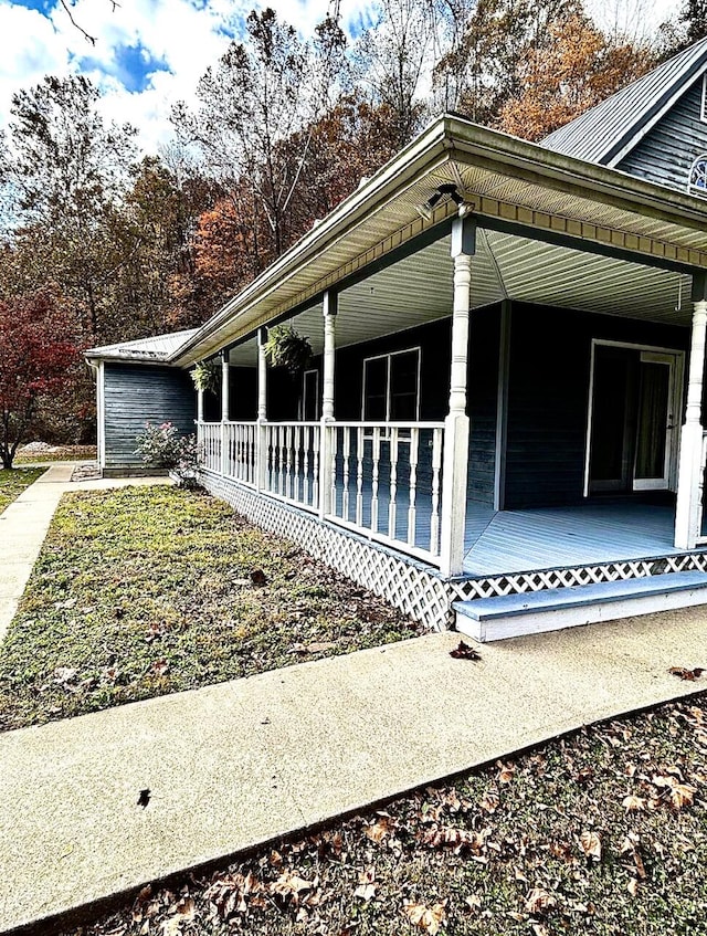 view of property exterior featuring covered porch