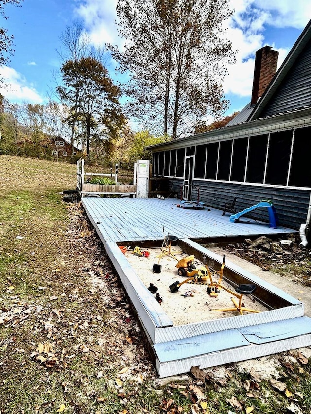 deck with a sunroom