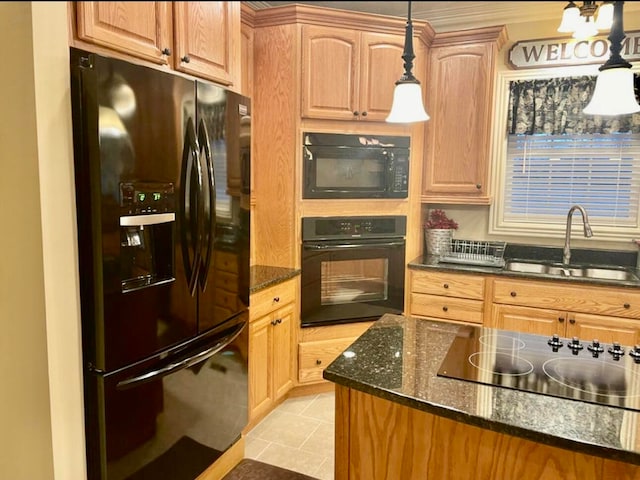 kitchen with sink, hanging light fixtures, dark stone counters, light tile patterned floors, and black appliances