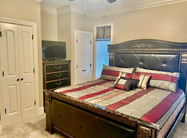 bedroom featuring carpet flooring, crown molding, and ceiling fan