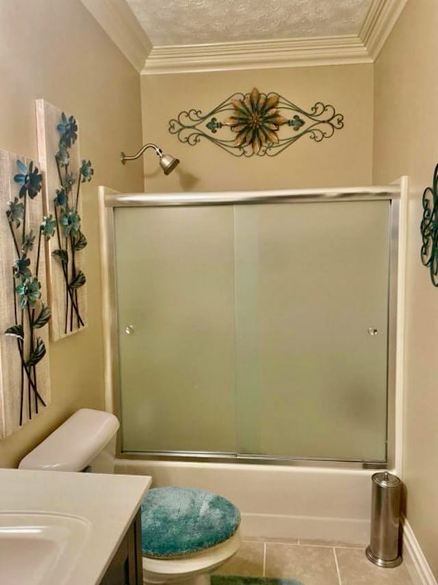 bathroom featuring tile patterned floors, toilet, combined bath / shower with glass door, and ornamental molding