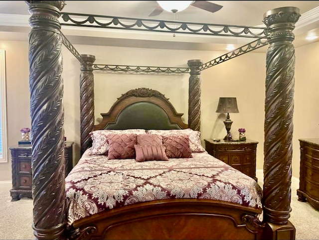 bedroom featuring ceiling fan, crown molding, and carpet floors