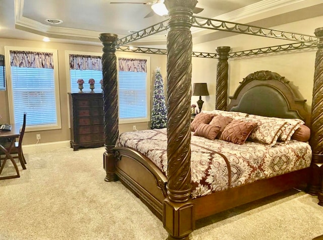 bedroom featuring multiple windows, ceiling fan, carpet floors, and ornamental molding