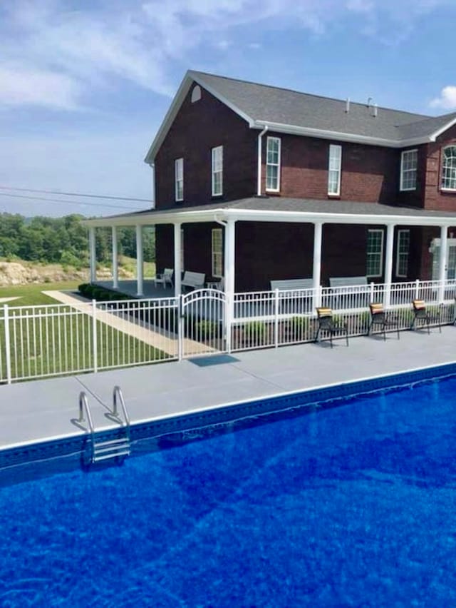 view of swimming pool featuring a patio area