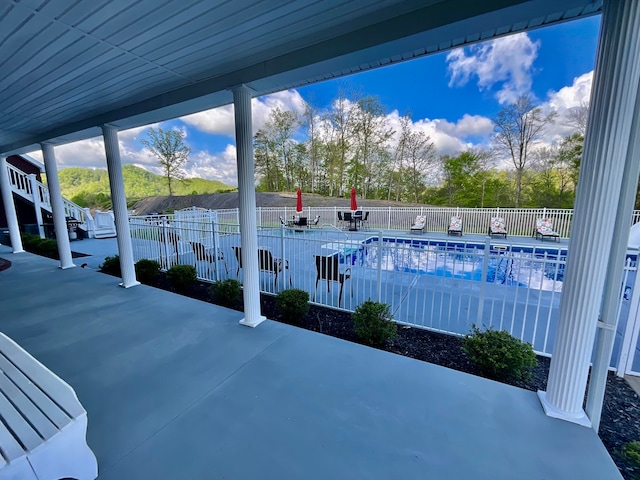 view of swimming pool with a patio area