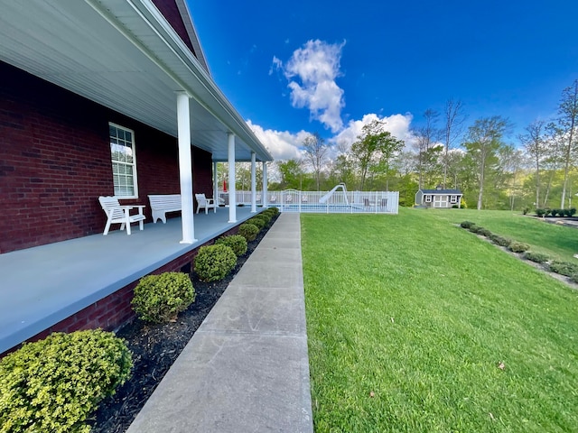 view of yard with a pool