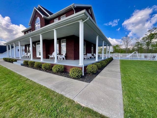 view of property exterior with a lawn and a porch