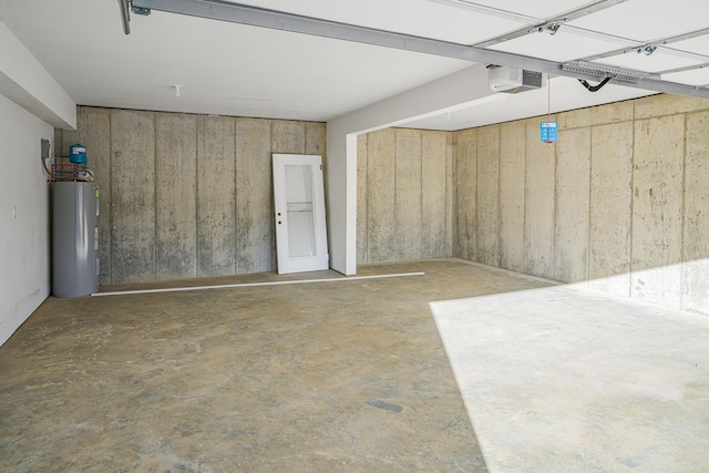 garage featuring a garage door opener and water heater