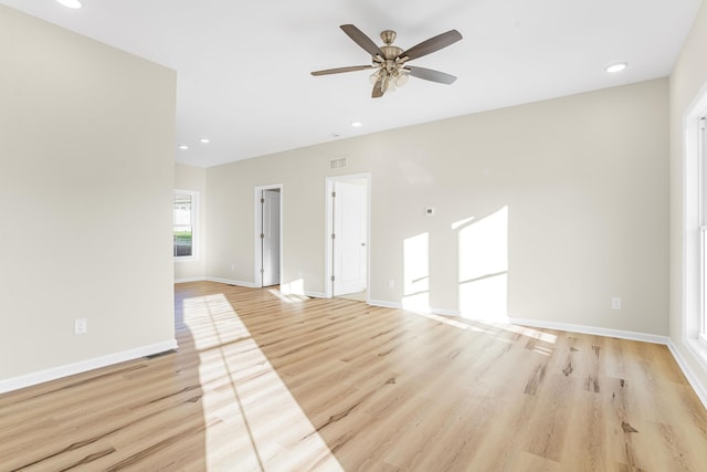 spare room with ceiling fan and light hardwood / wood-style flooring