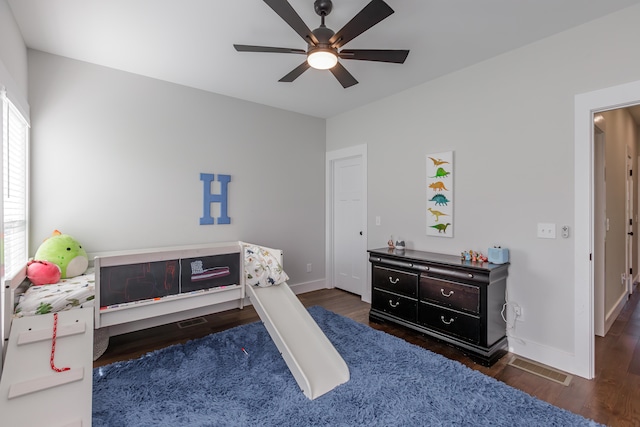 bedroom featuring dark hardwood / wood-style flooring and ceiling fan