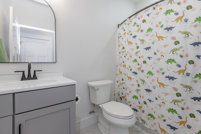 bathroom featuring tile patterned floors, vanity, toilet, and a shower with shower curtain