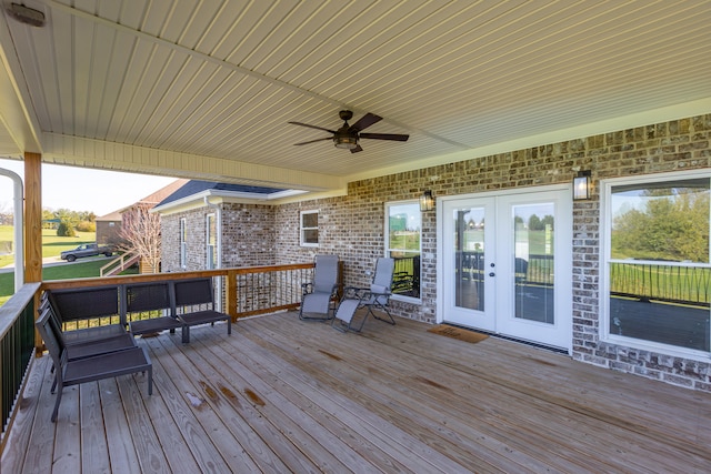 wooden deck featuring ceiling fan and french doors