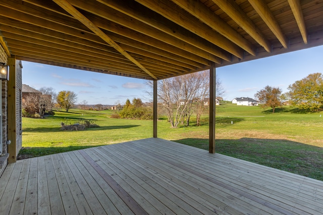 wooden terrace featuring a lawn