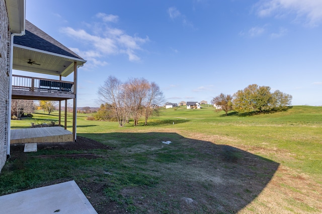 view of yard with ceiling fan