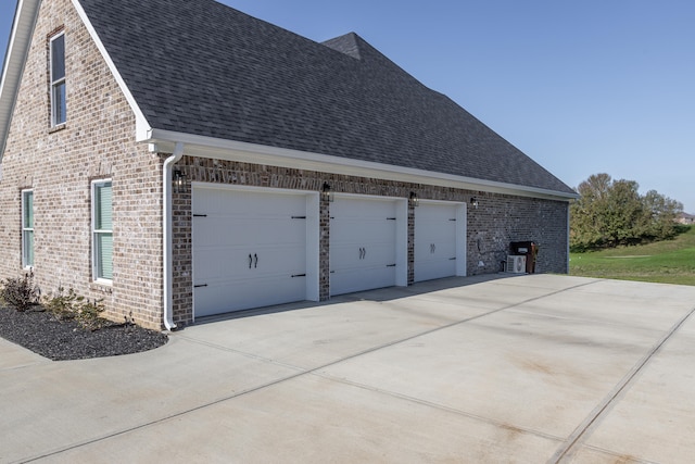 view of side of property with a garage