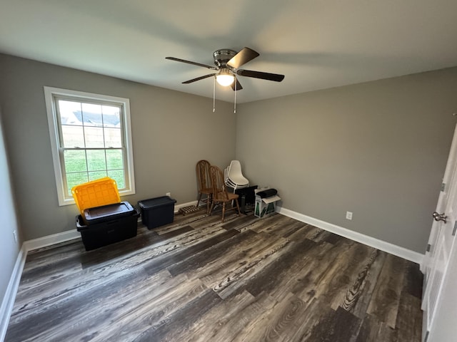 unfurnished room featuring dark hardwood / wood-style flooring and ceiling fan