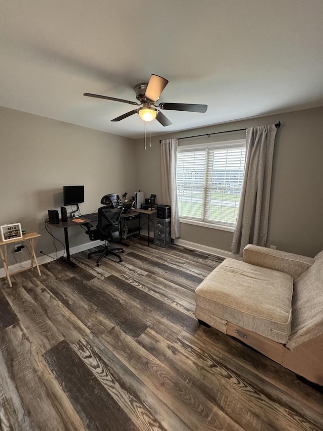 home office with ceiling fan and dark wood-type flooring