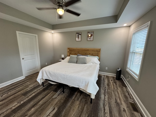 bedroom featuring ceiling fan and dark hardwood / wood-style floors