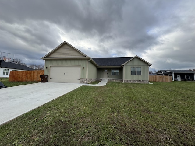 ranch-style house featuring a garage and a front yard