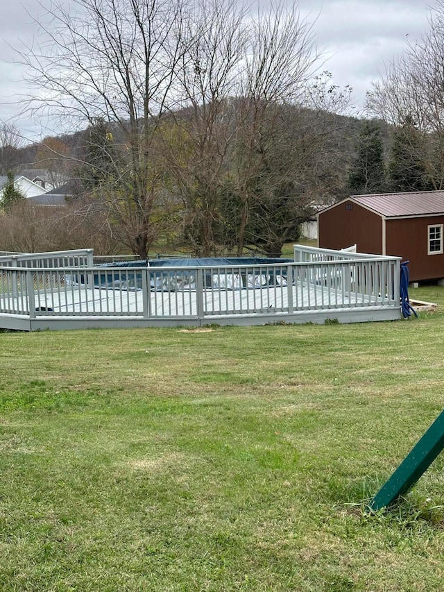 view of yard featuring a wooden deck