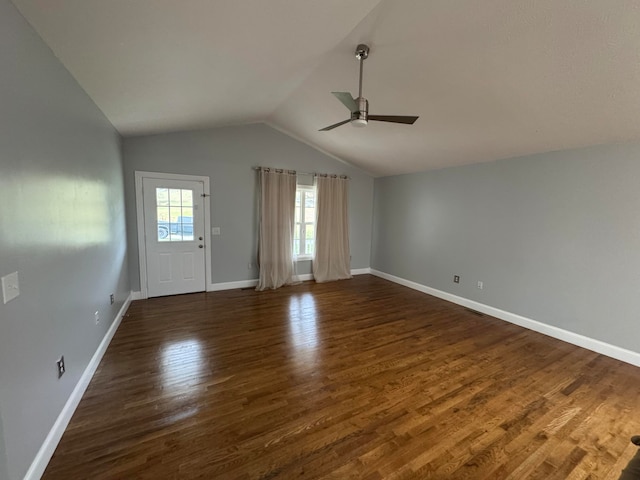 unfurnished living room featuring ceiling fan, dark hardwood / wood-style flooring, and lofted ceiling