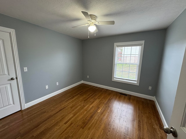 unfurnished room with ceiling fan, a textured ceiling, and hardwood / wood-style flooring