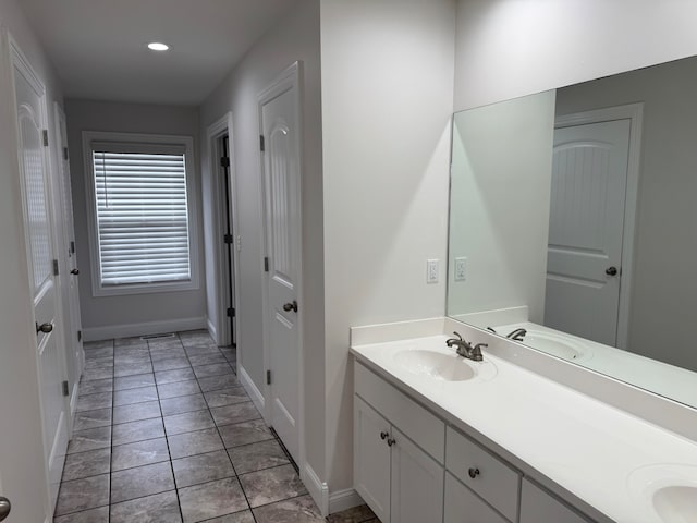 bathroom with tile patterned flooring and vanity