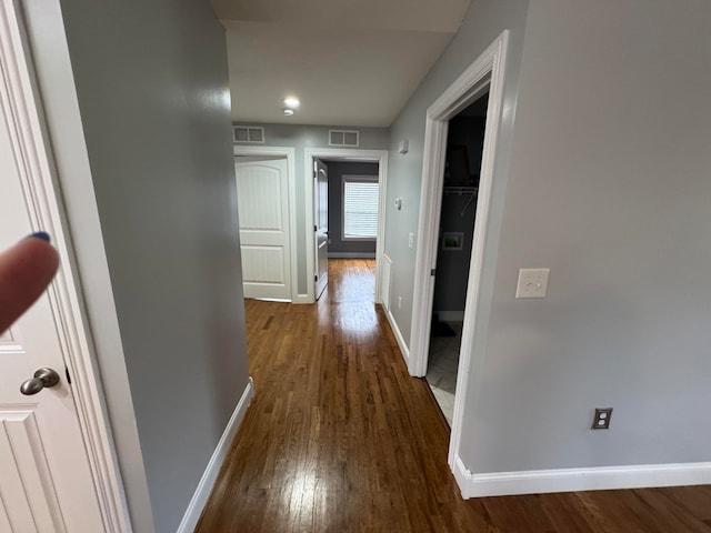 hall with dark hardwood / wood-style floors