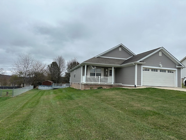 view of front of house featuring a front lawn, a porch, and a garage