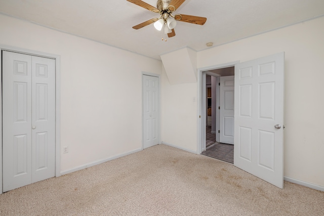 unfurnished bedroom featuring carpet flooring and ceiling fan