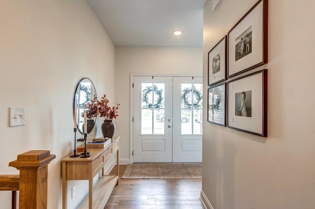 entrance foyer with hardwood / wood-style flooring and french doors