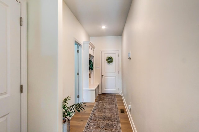 entryway with hardwood / wood-style floors