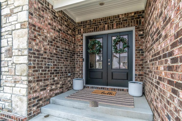 view of exterior entry featuring french doors