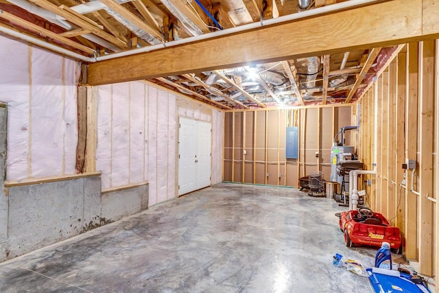 basement with gas water heater and electric panel