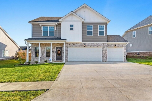 view of front of home featuring a garage and a front lawn