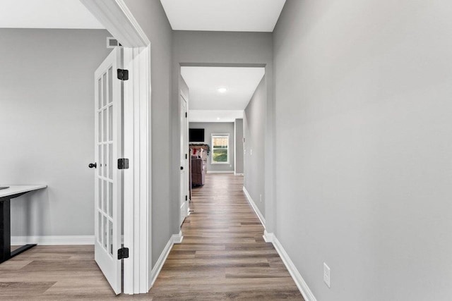 hall with light wood-type flooring