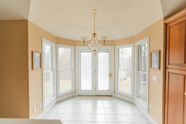 unfurnished sunroom with an inviting chandelier