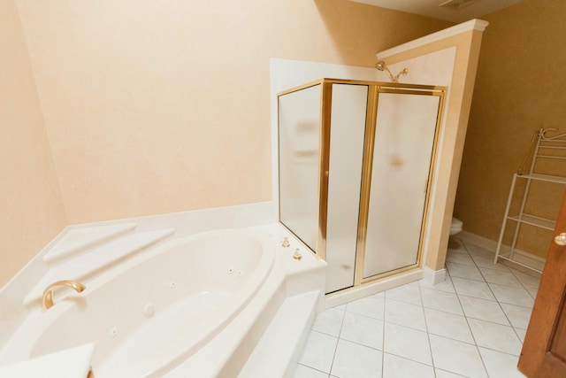 bathroom featuring tile patterned flooring, separate shower and tub, and toilet