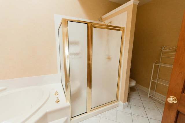 bathroom with tile patterned flooring, toilet, and independent shower and bath