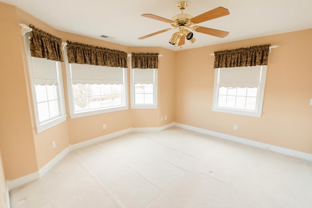 spare room with carpet flooring and ceiling fan