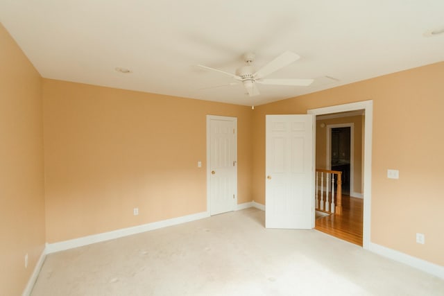 unfurnished bedroom with carpet flooring, a closet, and ceiling fan