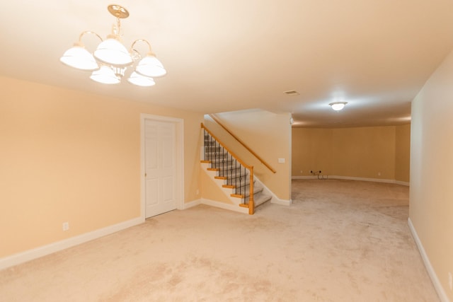 interior space featuring carpet and an inviting chandelier