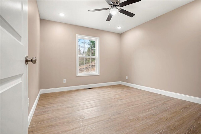 unfurnished room featuring ceiling fan and light hardwood / wood-style flooring